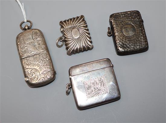 A Victorian silver combination sovereign/vesta case, Birmingham, 1886 and three other silver vesta cases.